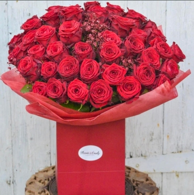 classic red roses bouquet with biggest head roses and long stems made up by Blooms and Candy London Florist with guaranteed London, UK delivery