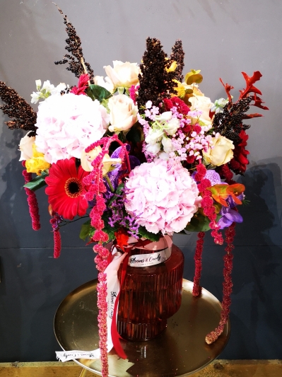 Let us take you onto the journey with this sexy vase with mixed roses, amaranthus, hydrangeasm daisies and complementary foliages and flowers. Made by Blooms and Candy London Florist forguaranteed London flower delivery