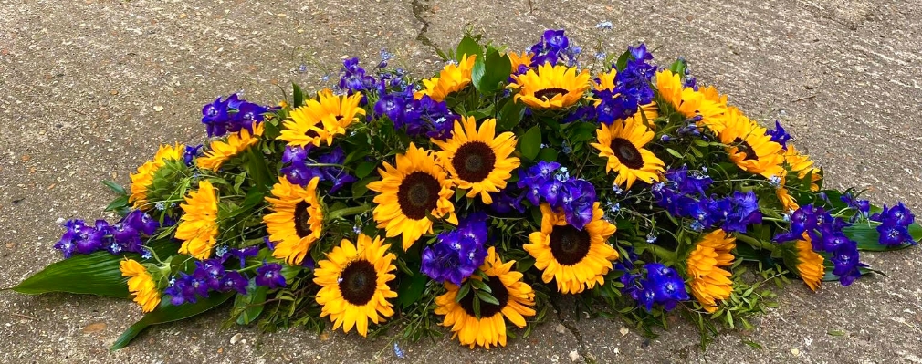 Sunflowers and Delphinium Coffin Spray