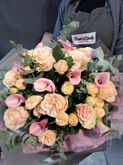 Sweet blush pinks and creams to bring back the memories or to truly surprise. Bouquet to include peach garden roses and calla lily, dressed with Eucalypthus and arranged in a compact luxurious look. made by independed london florist