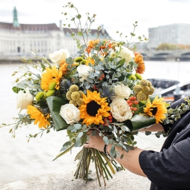 special rustic bouquet to include sunflowers, cream roses, yellow craspedia, blooms and lots of eucalypthus, for delivery in London, UK