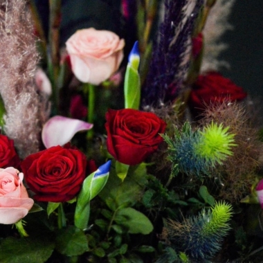 wild mixed of red and pink roses vase with tall pampas grass, thisle and other flowers made by Blooms and Candy London Florist with guaranteed London delivery