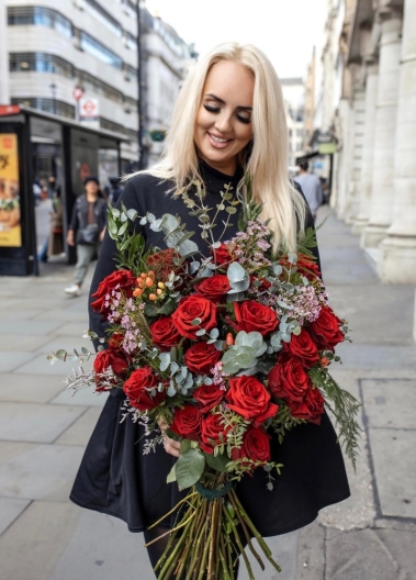 wild red roses arranged in a heart shaped bouquet with eucalypthus, pussy willow and matching foliages. Made by Blooms and Candy LOndon florist for guaranteed London delivery